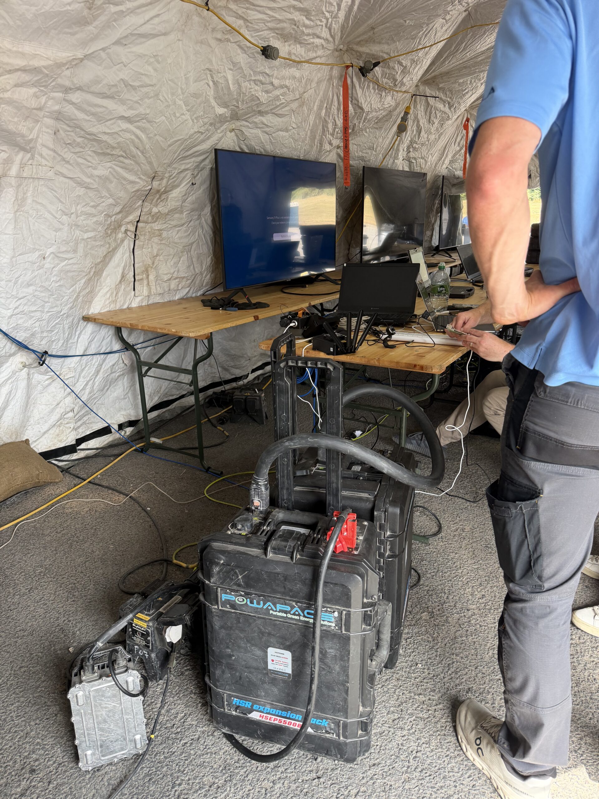 Powapacs HSR M-Spec unit powering screens and laptops inside a command post tent