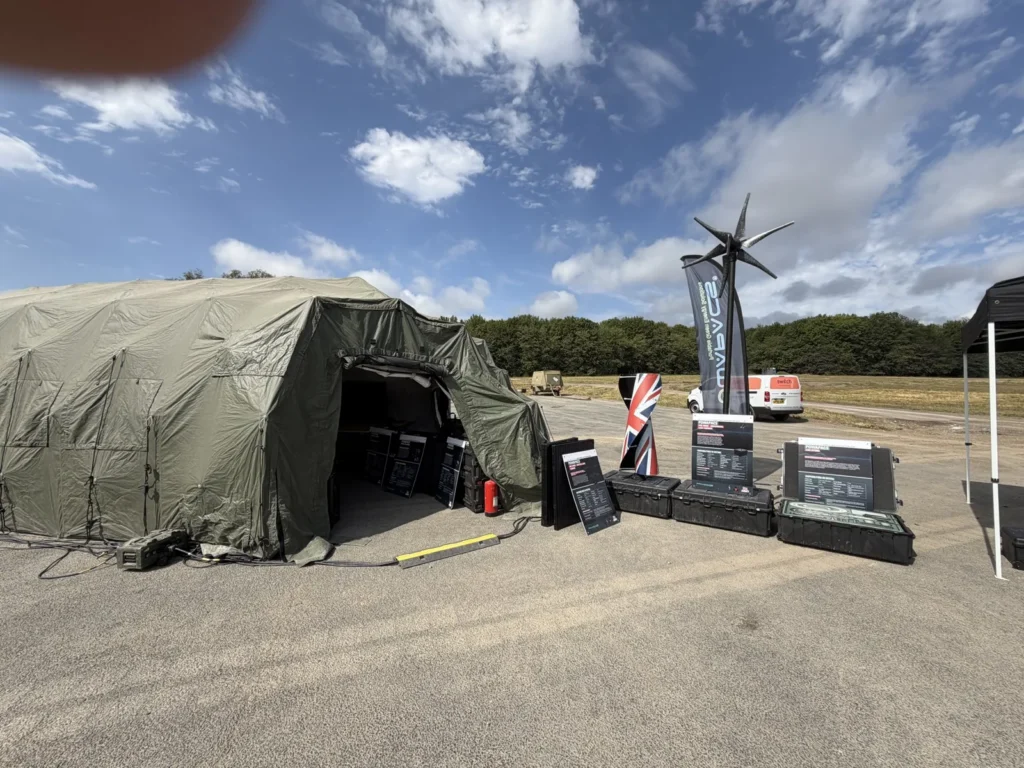 Powapacs demonstration stand with ARC Wind turbine beside a command post tent on Exercise Staff Shield 3